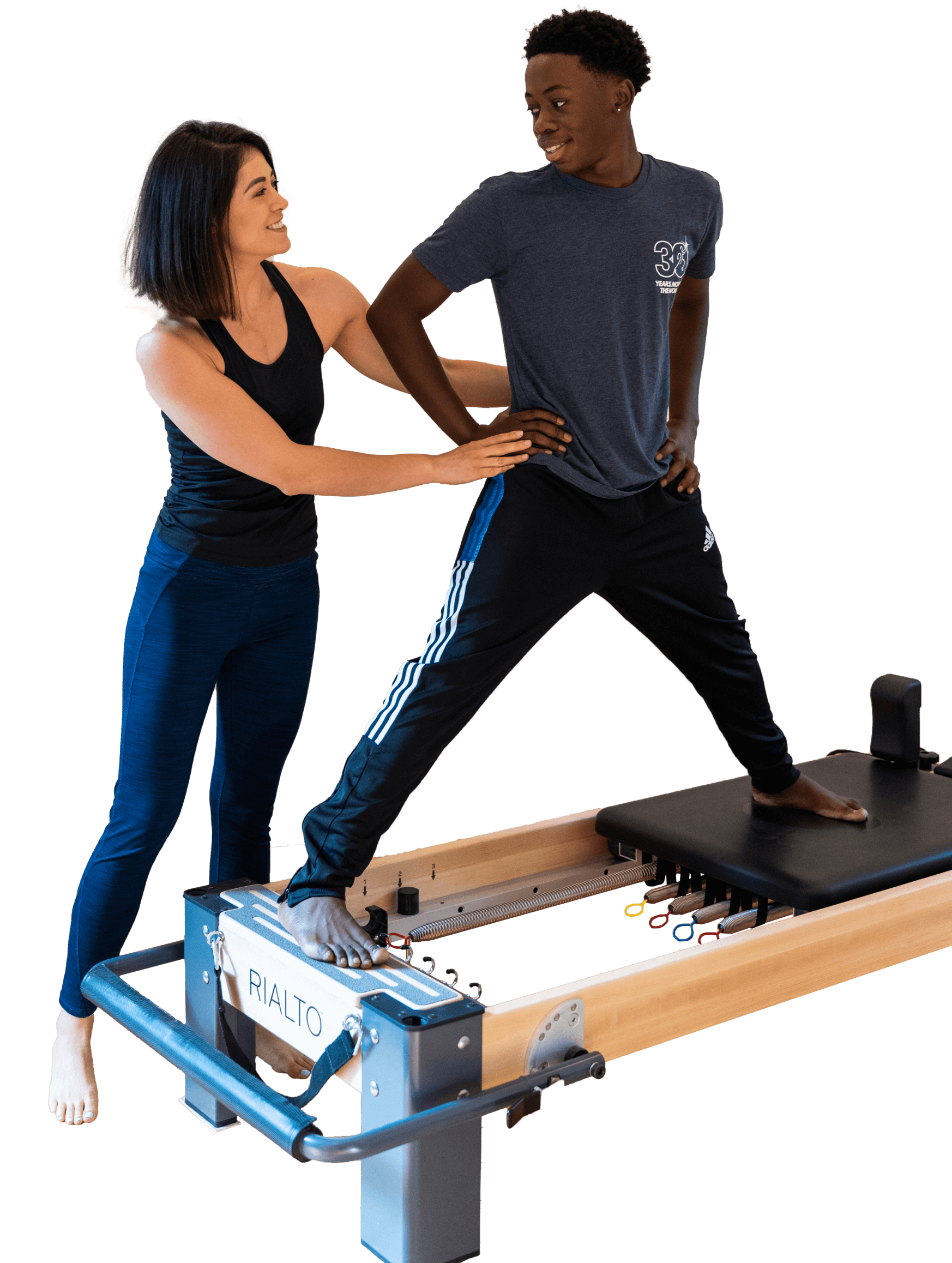 Pilates Teacher Teaching on the Reformer with a Student